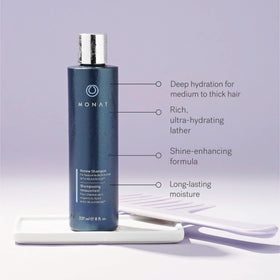 MONAT Renew shampoo cap dispensing rich lather for gentle cleansing.