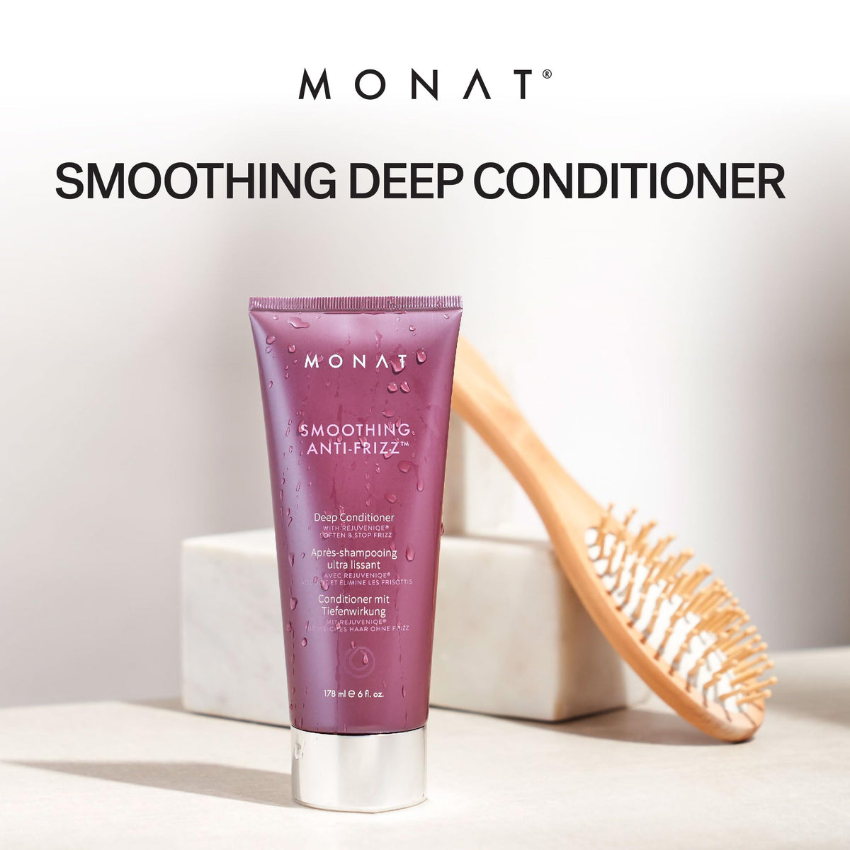 Creamy texture close-up of MONAT conditioner for frizz control.