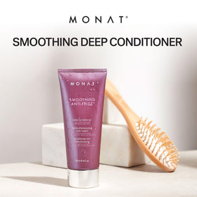 Creamy texture close-up of MONAT conditioner for frizz control.