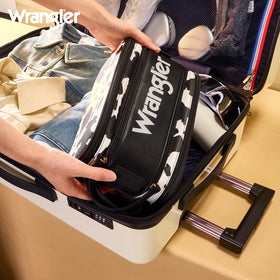 Montana West Wrangler cowprint makeup bag with spacious main compartment and dividers.