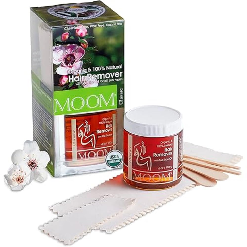 MOOM Organic Sugar Wax jar close-up highlighting tea tree oil benefits.