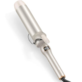 Mooqlizz curling iron with 2-inch barrel creating loose waves on long hair.