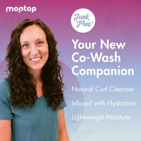 Close-up foamy lather shows gentle cleansing for curly textures.