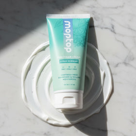 MopTop Curl Cream packaging close-up highlights clean ingredients for healthy curls