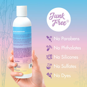 MopTop Leave-In Conditioner on dry hair reducing frizz and adding shine.