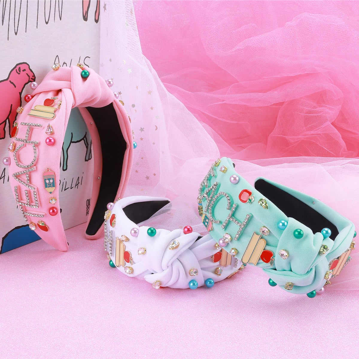 MOSOTECH headband features book and apple charms for educational flair.
