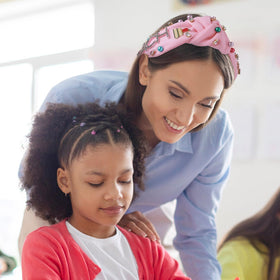 MOSOTECH pink headband worn for a lightweight, all-day school-ready style.