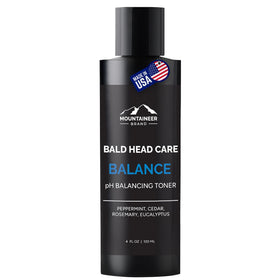 Mountaineer Brand Natural Anti Shine bottle shown to reduce scalp shine on bald head.