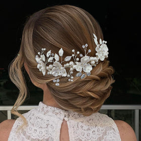 Mpoikba wedding headband with crystals and pearls elevates bridal look.
