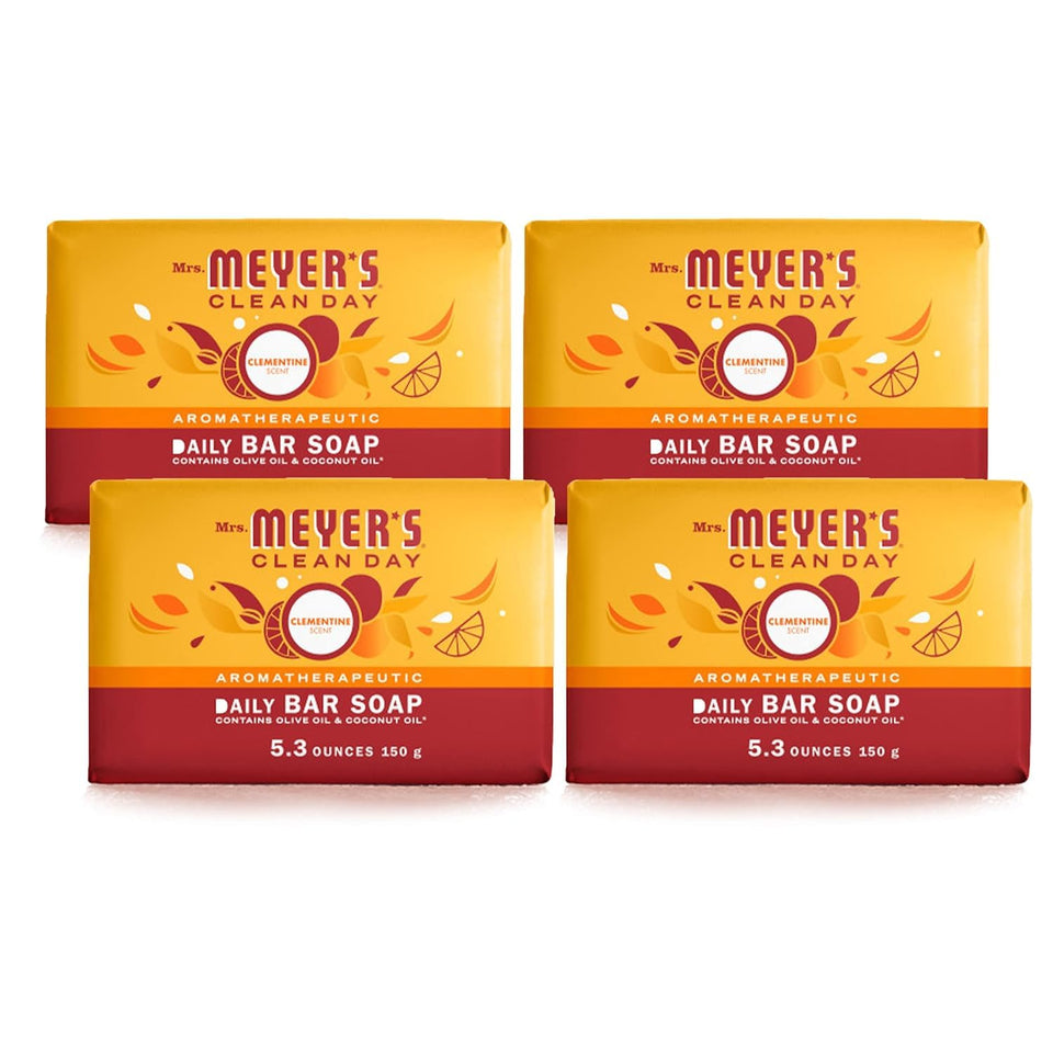 Mrs. Meyer's Clementine bar soap in hands with bright citrus cleanse.