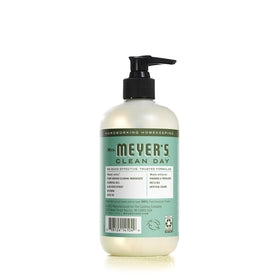 Clear glass bottle showcasing natural ingredients and garden-inspired scent.