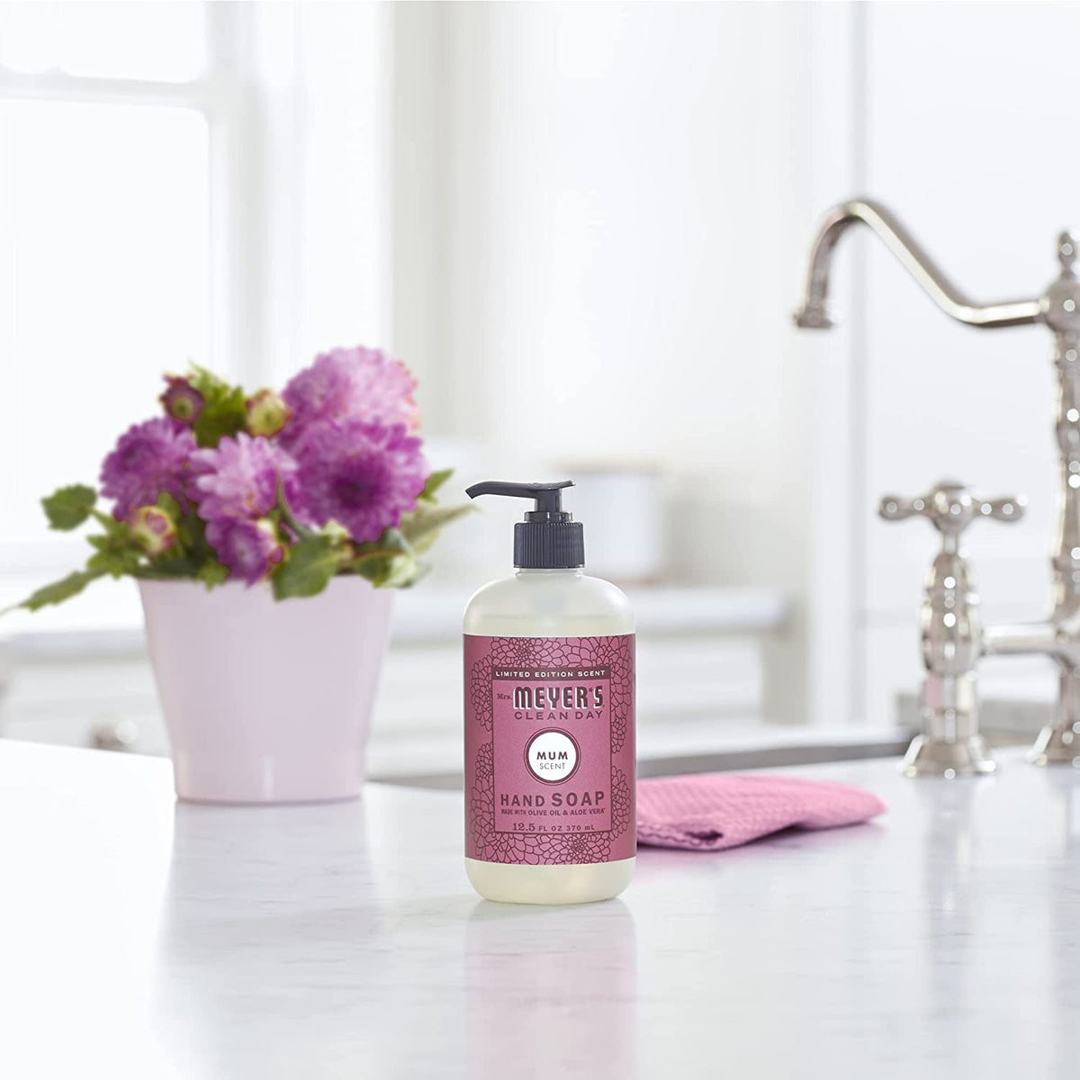 Pump-top of Mrs. Meyer's Clean Day Mum hand soap delivering a gentle lather for quick cleansing