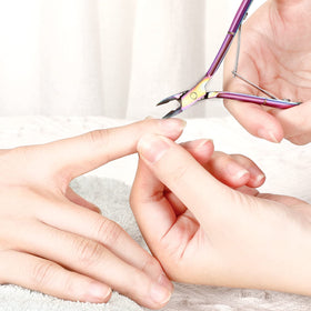 Mudder cuticle nippers in use for safe cuticle removal