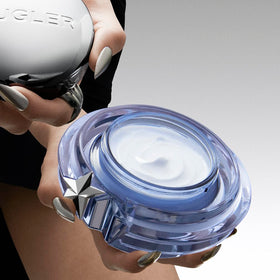 Mugler Angel Body Cream being applied to skin for immediate comfort.