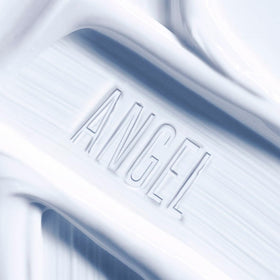 Close-up of the creamy texture of Mugler Angel Body Cream for lasting moisture.