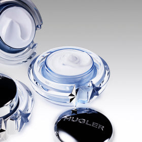 Mugler Angel Body Cream lid with star motif enhances a luxurious self-care ritual.