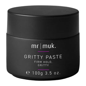 Mr MUK Strong Hold paste jar close-up, showcasing texture and firm hold for lasting style.