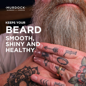 Murdock London beard oil bottle on shelf signaling natural nourishment and gloss.