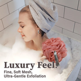 The myHomeBody loofah sponge in coral red enhances your shower routine with exfoliating texture.