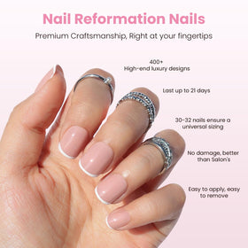 Nail Reformation nails on finger display a glossy white French tip.