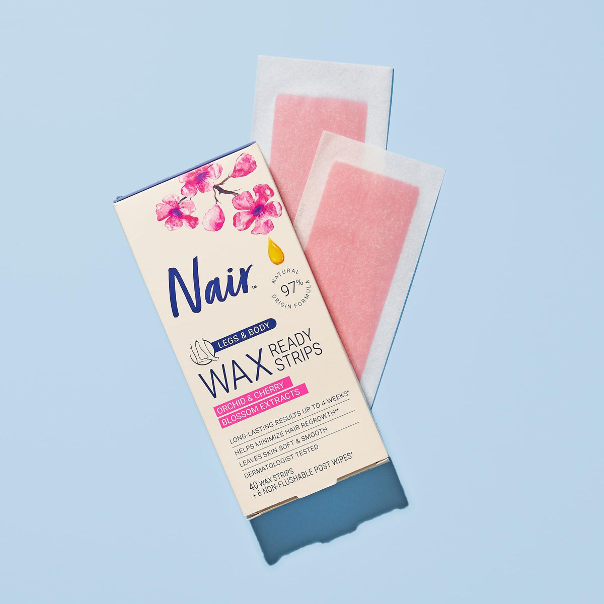 Nair wax strip being pressed down and smoothed for effective pull.