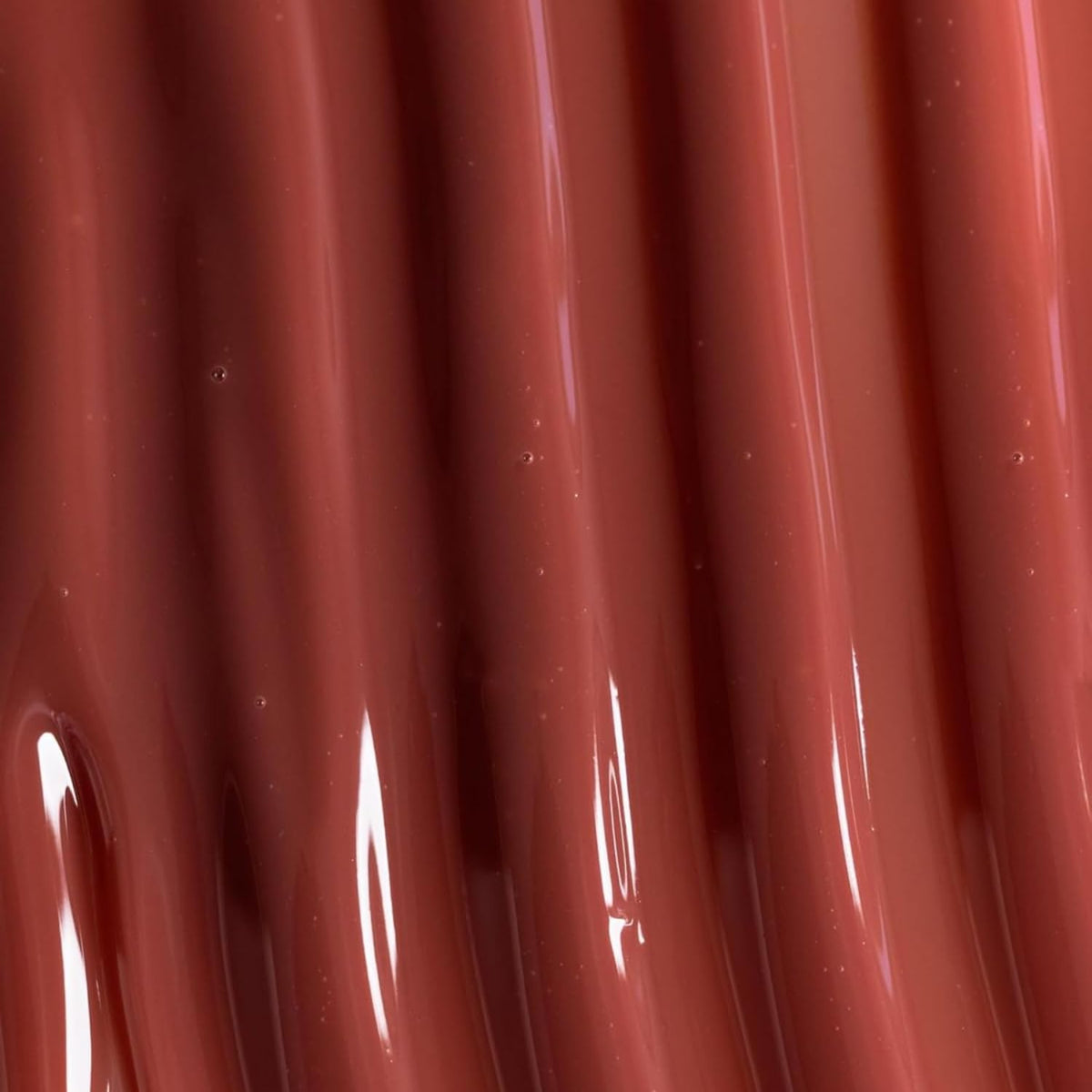 Naked Sundays Poutscreen can be worn solo or layered over lipstick for shine.