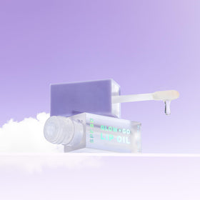 Naked Sundays Glow & Go Lip Oil application scene showing smooth non sticky texture