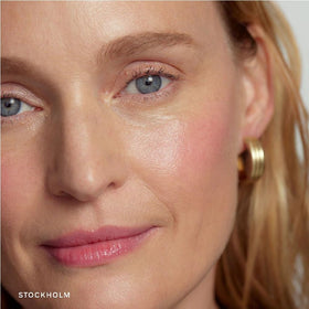 NAPH M Flush Balm on lips for subtle color and smooth look