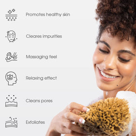Naroa Soft Natural Shower Sponge in hand demonstrates soft texture for luxurious lather.