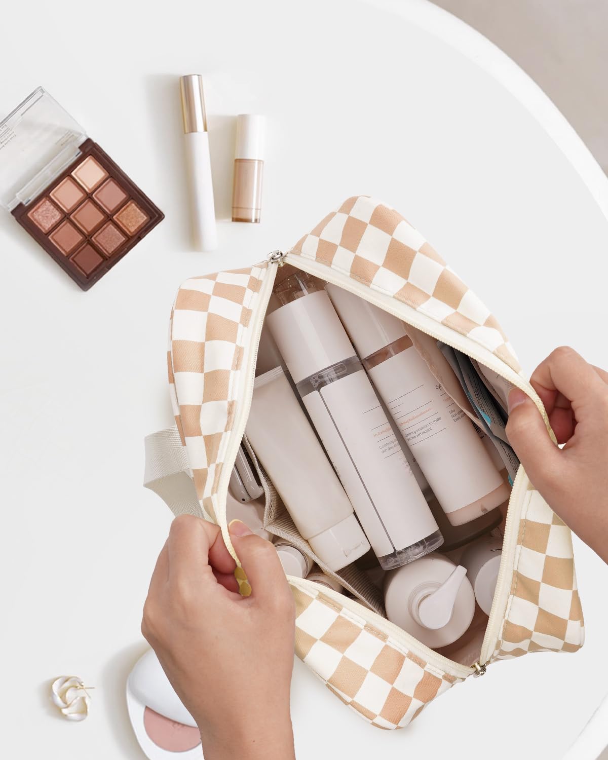 Narwey opened bag showing multiple compartments for toiletries and makeup.