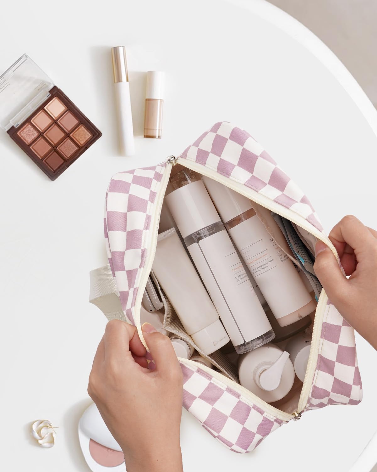 Narwey soft-lined, water-resistant cosmetic bag protects contents during travel.