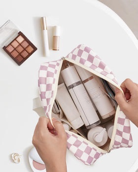 Narwey soft-lined, water-resistant cosmetic bag protects contents during travel.