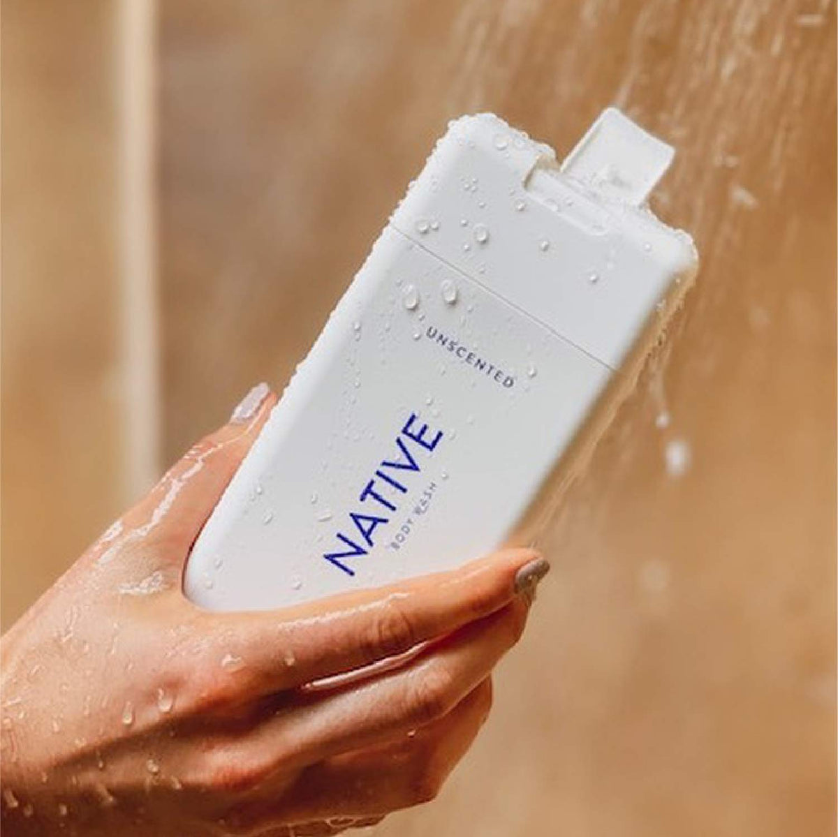 Native Body Wash bottle pour—smooth, controlled dispensing in shower.