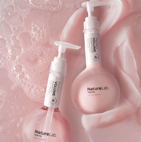 NatureLab.TOKYO Perfect Volume Conditioner bottle demonstrates glide for smoother, fuller hair.