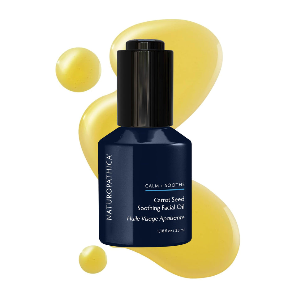 Naturopathica carrot seed soothing facial oil bottle delivering deep hydration for sensitive skin.