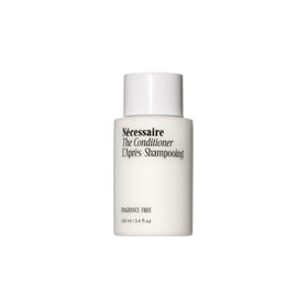 Nécessaire The Conditioner Mini bottle closeup highlights fragrance-free formula for sensitive scalps.