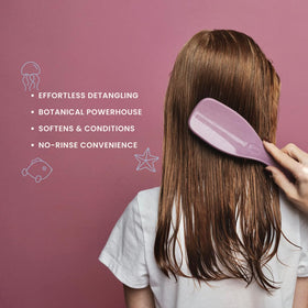Nemah Kids Leave-In Conditioner brush application showing easy detangling use.