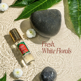 Nemat International Egyptian Musk Roll-On in hand during application for quick refresh.