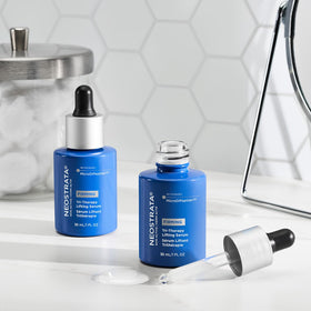 NEOSTRATA Tri-Therapy Lifting Serum on vanity shelf.