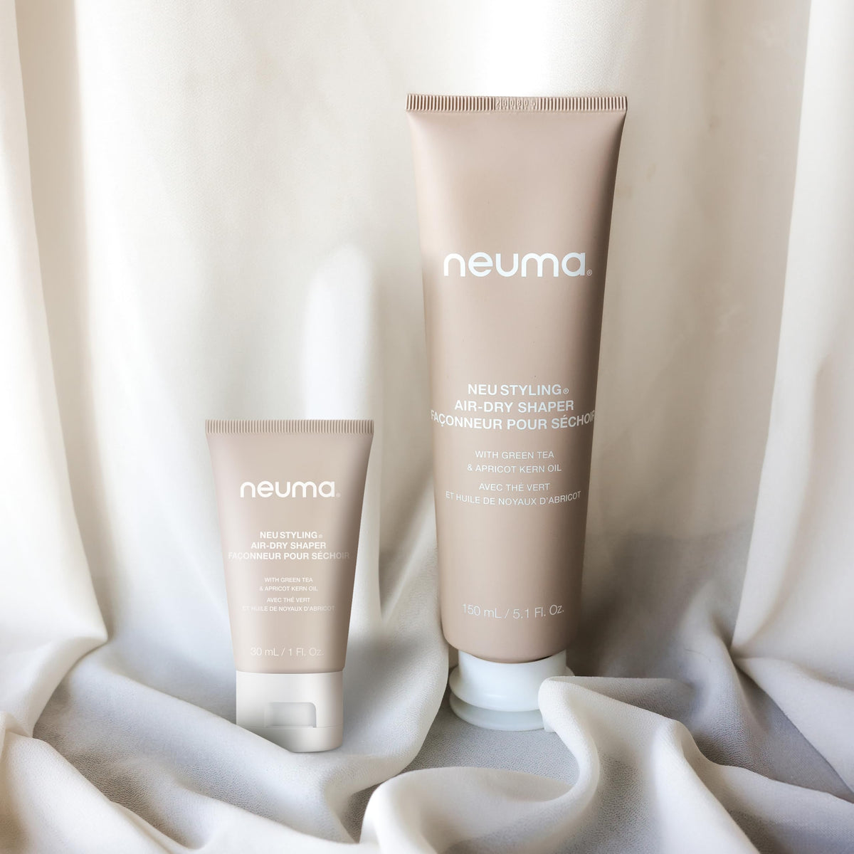 Neuma Neu Styling Air-Dry Shaper Cream bottle in a sunlit setup for easy everyday styling.
