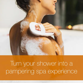 Neutrogena Rainbath bottle being poured to show lather-ready cleansing