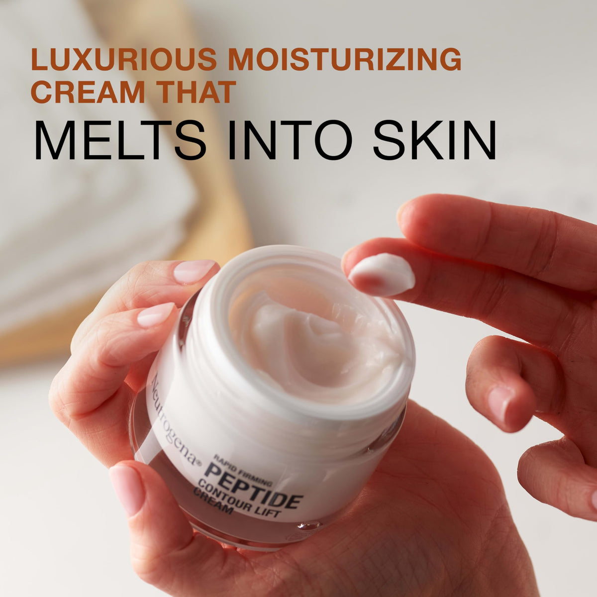 Neutrogena Rapid Firming Peptide Contour Lift Face Cream application on skin for glow and lift