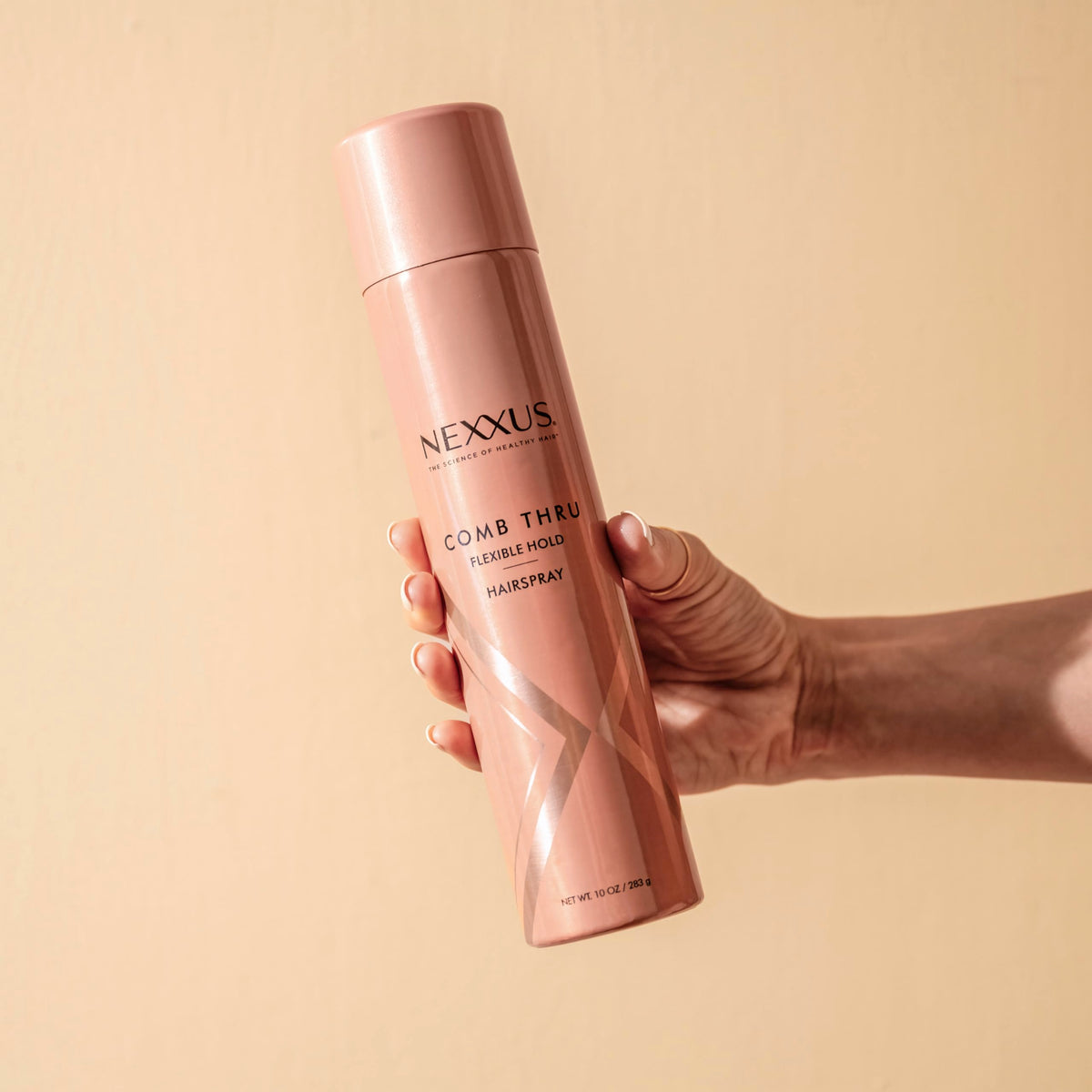 Nexxus Comb Thru Finishing Mist demonstrating added volume