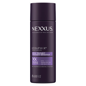 Nexxus Keraphix pre-wash cream bottle ready for application to damaged hair.