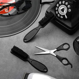 NICEMOVIC barber brush in-hand use; easy grip for blade cleaning.