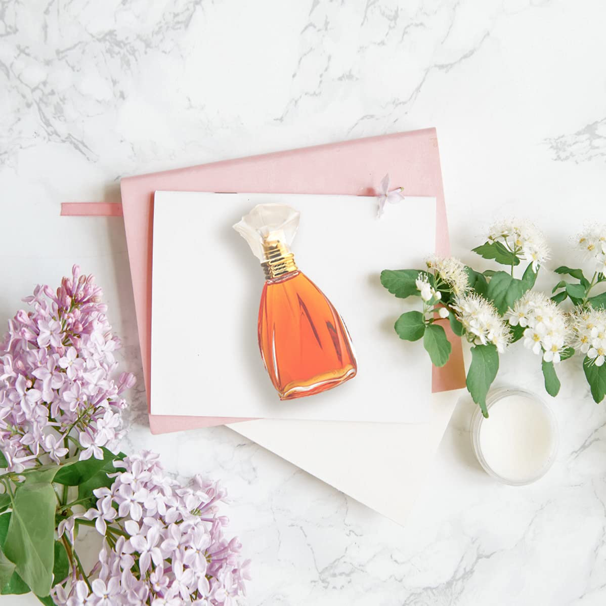 Nicole Miller travel spray shows portable fragrance for trips