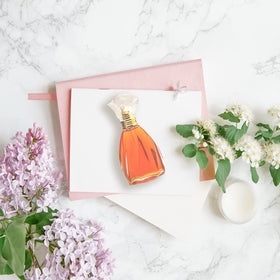 Nicole Miller travel spray shows portable fragrance for trips