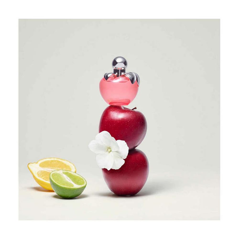 Side view of Nina Ricci Parfum Nina 80 ml bottle for versatile use.