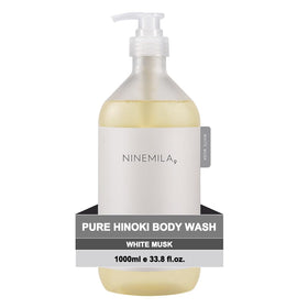 NINEMILA Pure Hinoki Body Wash bottle on a clean shelf for daily calming cleanse.