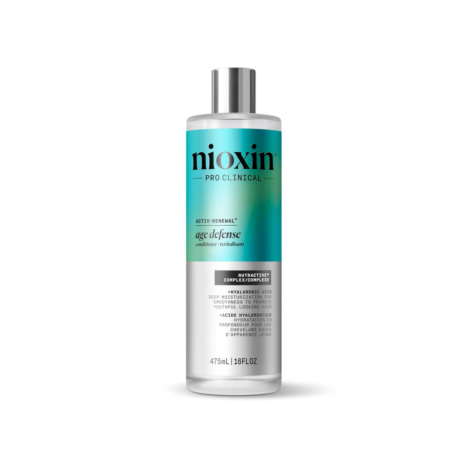 NIOXIN Age Defense Conditioner bottle showing lightweight moisture for aging hair